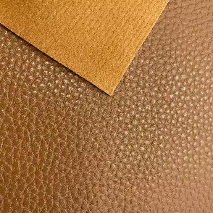 Iraunkorrak 1,45 mm leunak Pvc larruzko binilozko ehuna Faux larruzko erroiluak Pvc larruzko poltsetarako