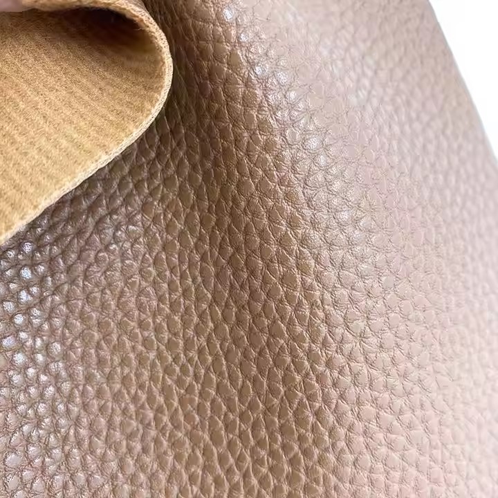 Iraunkorrak 1,45 mm leunak Pvc larruzko binilozko ehuna Faux larruzko erroiluak Pvc larruzko poltsetarako